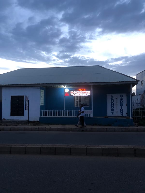 Dusk settles over Jos streets, churches, and storefronts