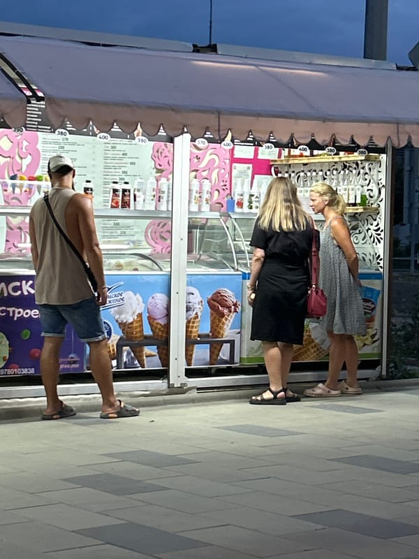 Summer evening stroll along Shchyolkino's promenade, cats and ice cream included