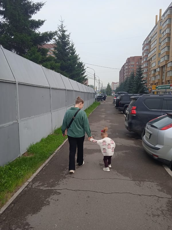 Krasnoyarsk neighborhood street-level snapshot: shops, apartments, odd details