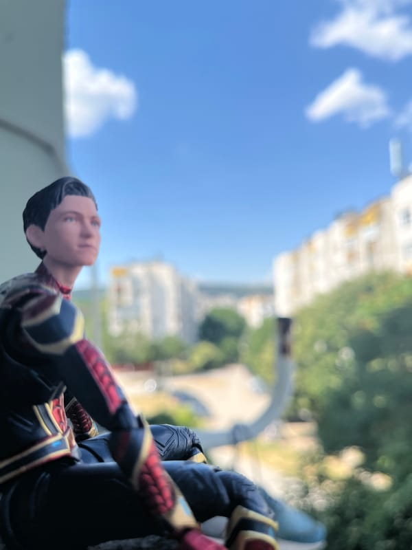 Spider-Man figures posed around Shumen in a casual photo session