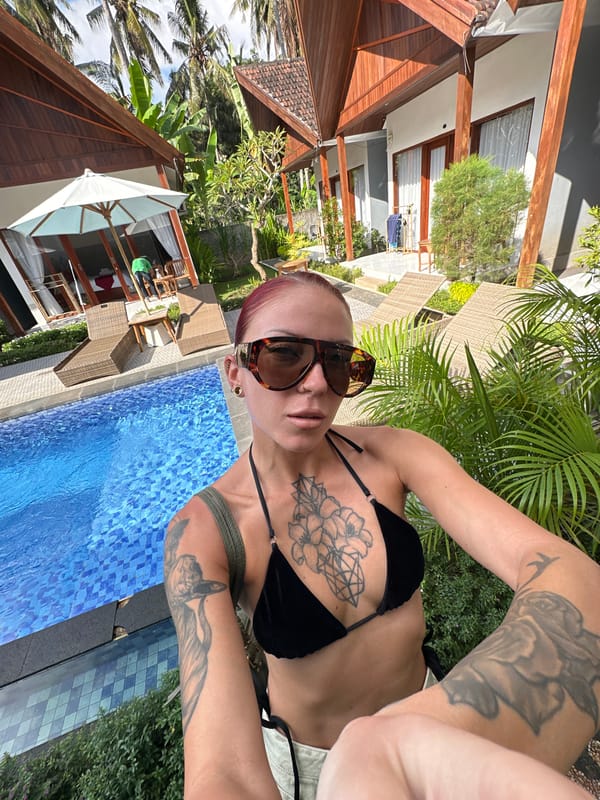 Woman takes poolside selfie in tropical Nusa Penida setting
