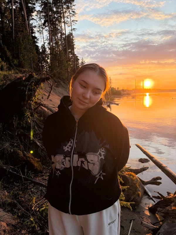 Young people document sunset moment at Chaikovsky waterfront