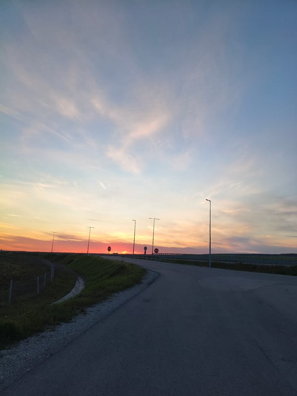 Colorful sunset captured over rural highway in Gradishte, Bulgaria