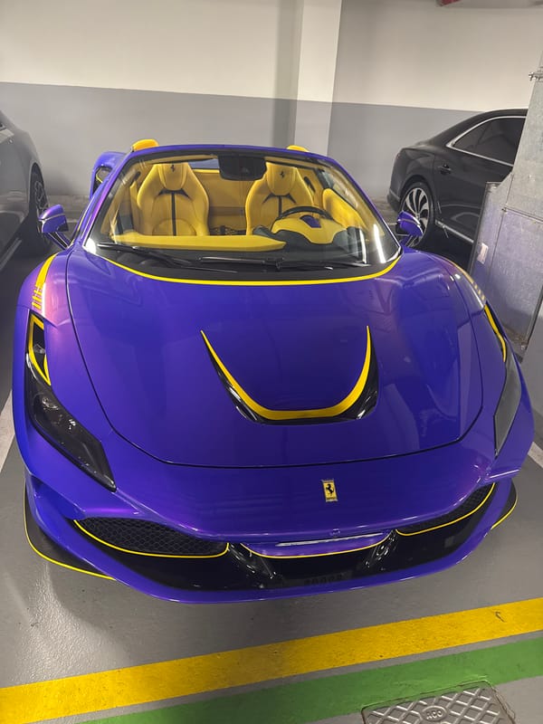 Blue Ferrari with yellow accents spotted in Dubai parking garage
