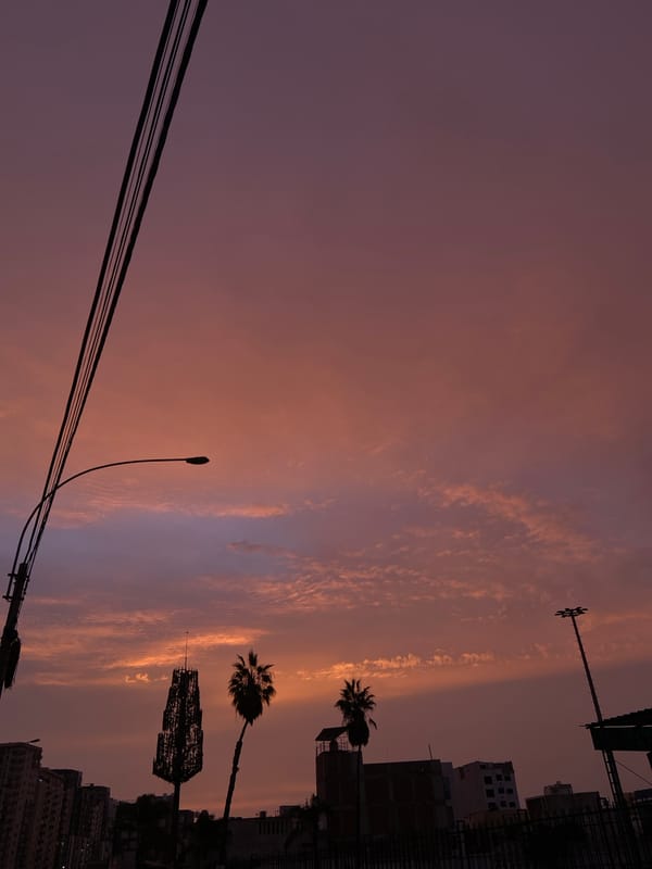 Colorful sunset observed over urban San Miguel, Peru