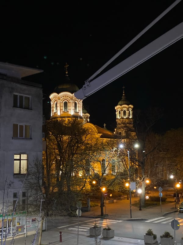 Evening social gathering near illuminated church in Stara Zagora
