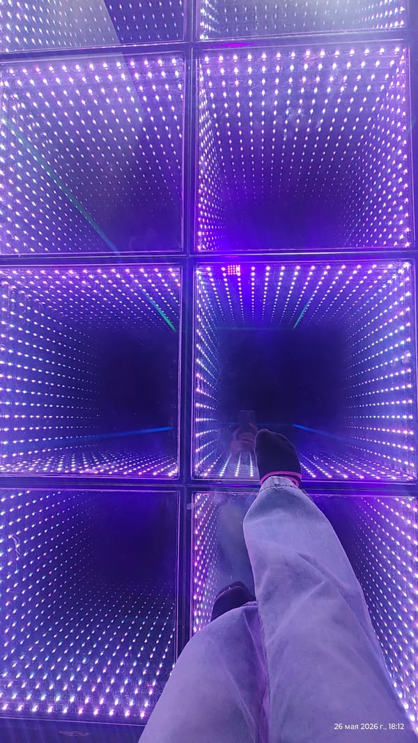 Person experiences optical illusion tunnel floor installation in Almaty