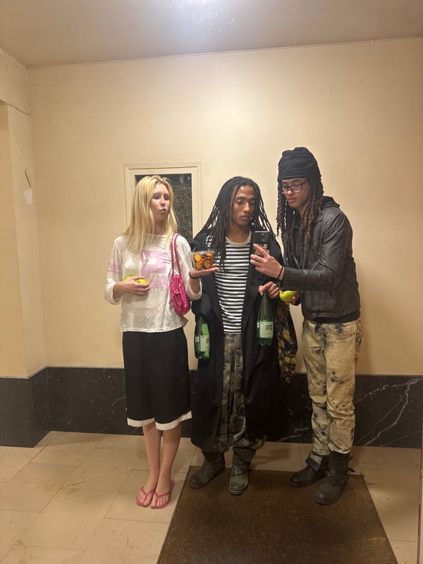 Three people gather in Paris hallway