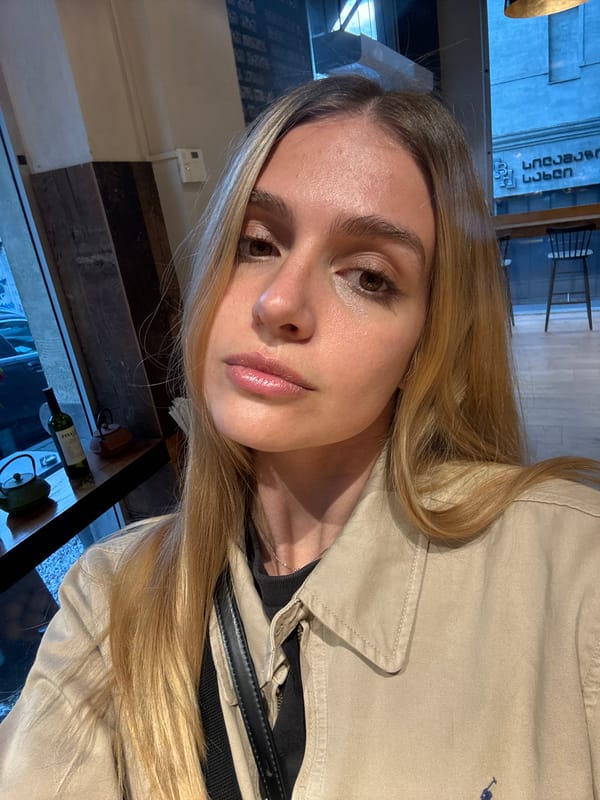 Woman takes selfie at Tbilisi cafe serving baguette sandwiches