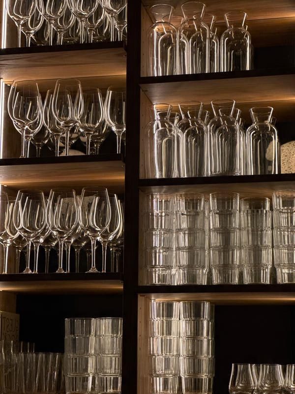Glassware shelves documented at Vienna commercial establishment