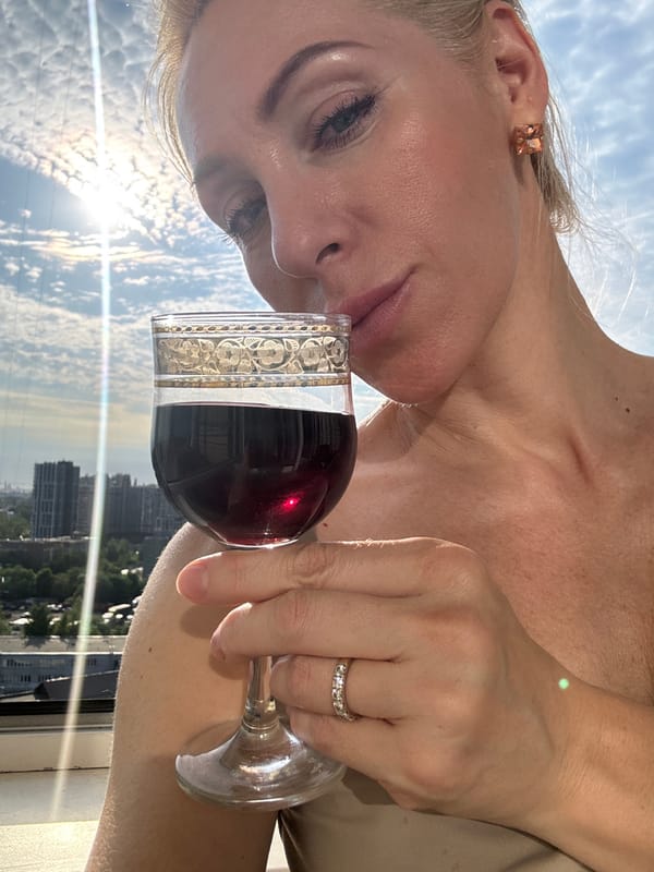 Woman enjoys wine and fruit on Russian balcony afternoon