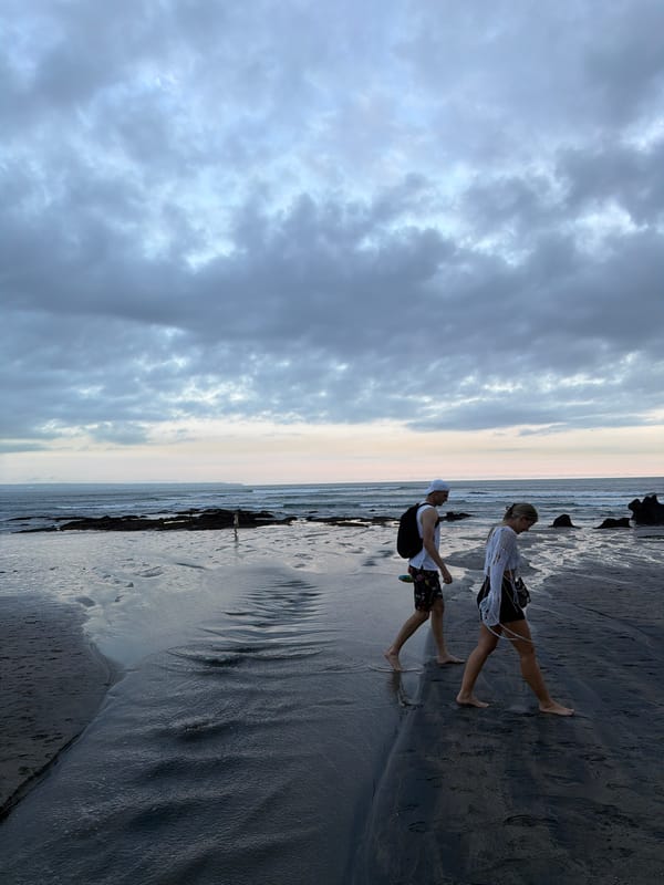 Wedding photoshoot captured on North Kuta beach under overcast skies