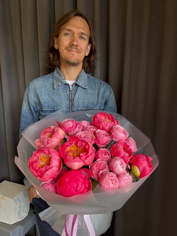Man with flower bouquet spotted in rainy Izhevsk morning
