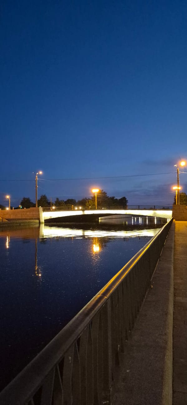 Saint Petersburg bridge glows at dusk during white nights