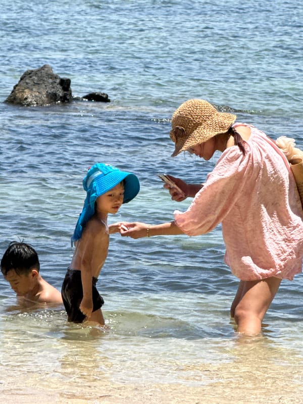 Wading and splashing in calm shallow ocean water