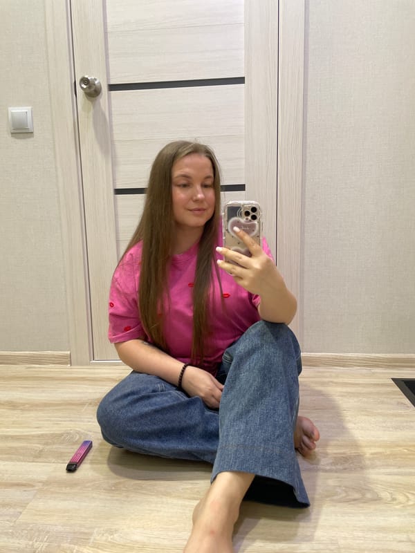 Woman takes selfies while drinking beer in Russian home