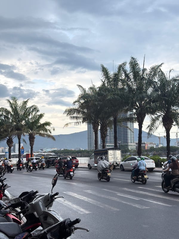 Da Nang streets and a riverside restaurant on a cloudy morning