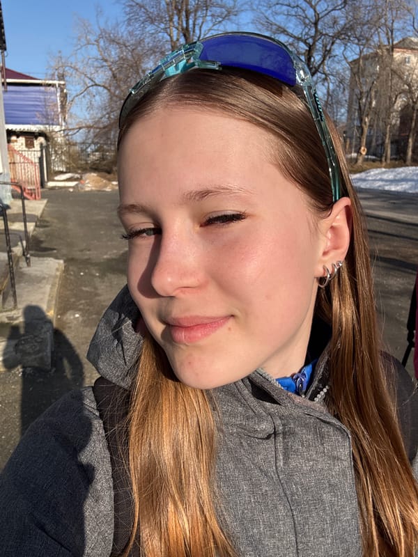 Young woman photographed in Berezniki wearing sunglasses, silver earrings