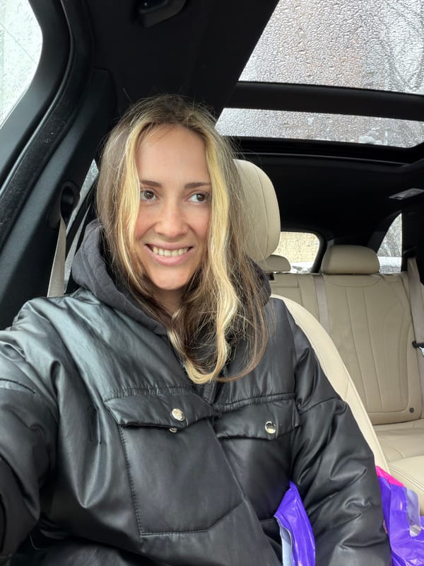 Woman photographed smiling in car in Khimki, Russia