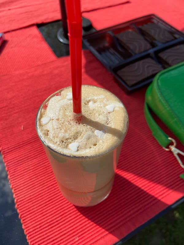 Iced coffee and sweets observed at outdoor table in Mindia