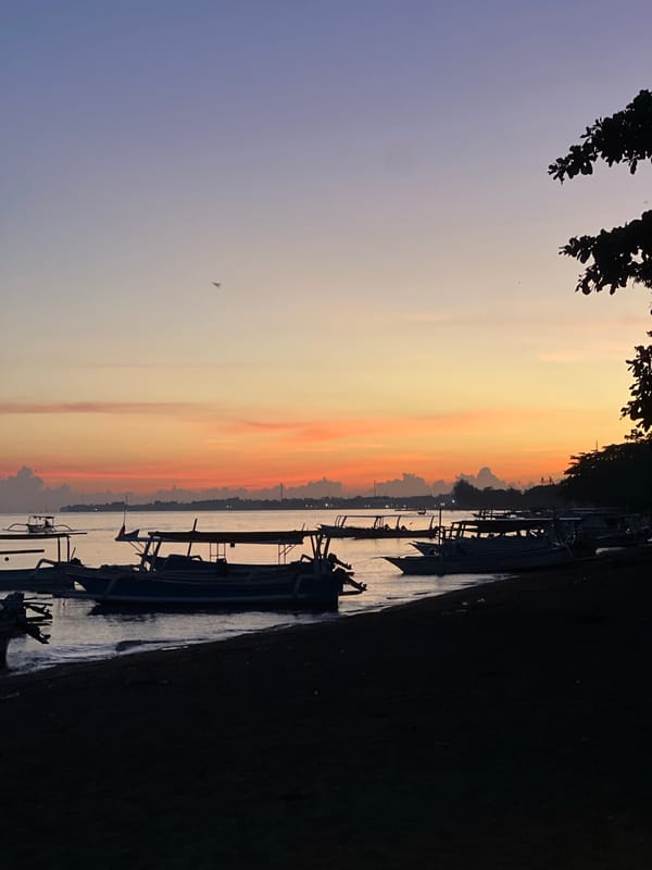 Sunset observed along Buleleng Indonesia coast with boats