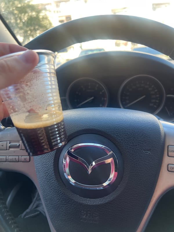 Driver holds drink in Mazda vehicle in Burgas