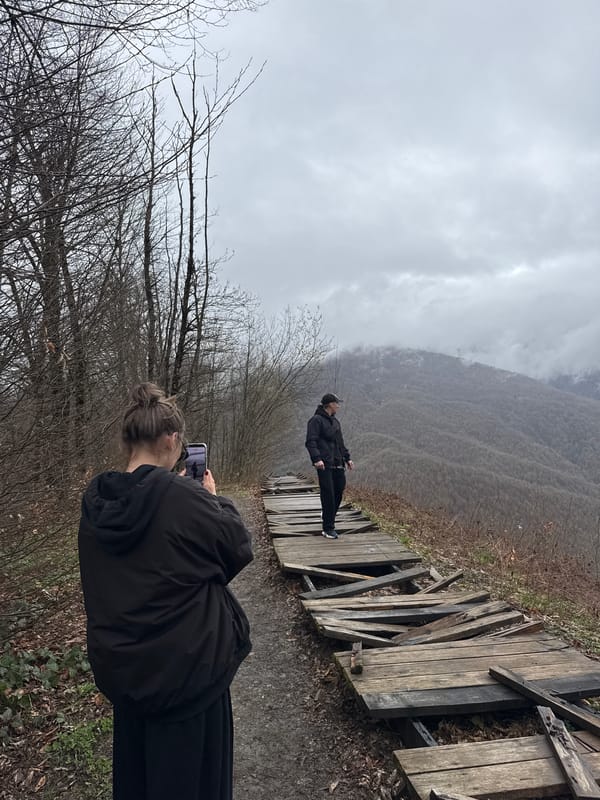 Overcast day documentation captures Estosadok's mountains and woodland scenes