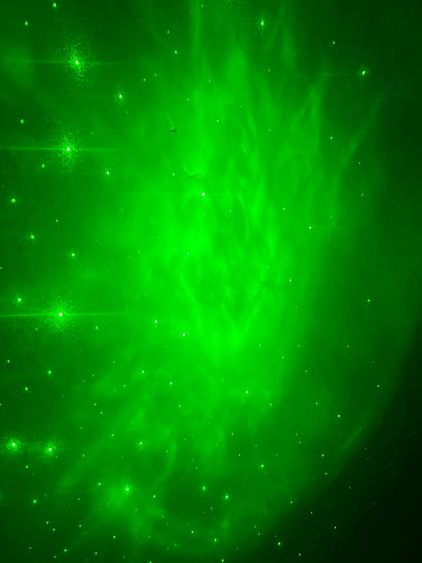 Green celestial phenomenon with light streaks observed in Nizhny Tagil
