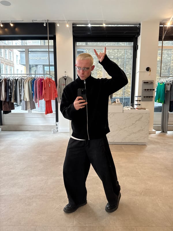 Man Takes Peace Sign Selfie in London Shop