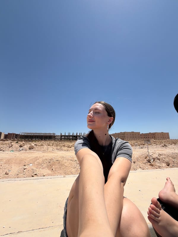 Relaxed morning outdoors near a modern Egyptian complex