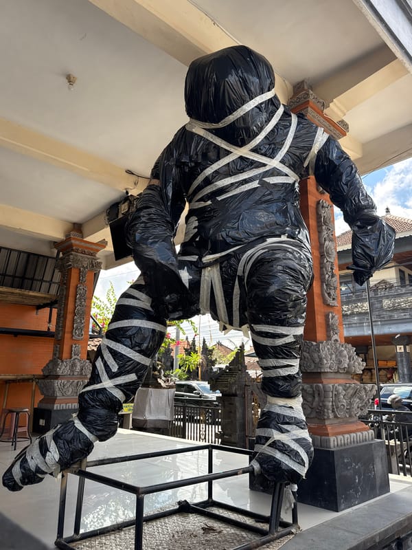 Ceremonial effigy wrapped and staged for Balinese ritual in Ubud