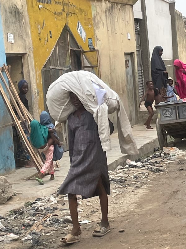Daily street life captured across urban area afternoon