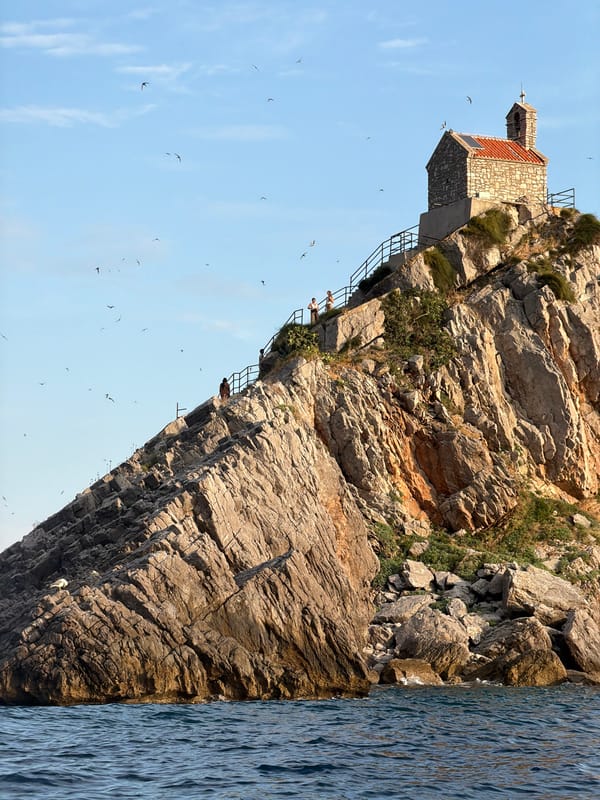 Summer afternoon on Petrovac's pebble beach and Adriatic bay