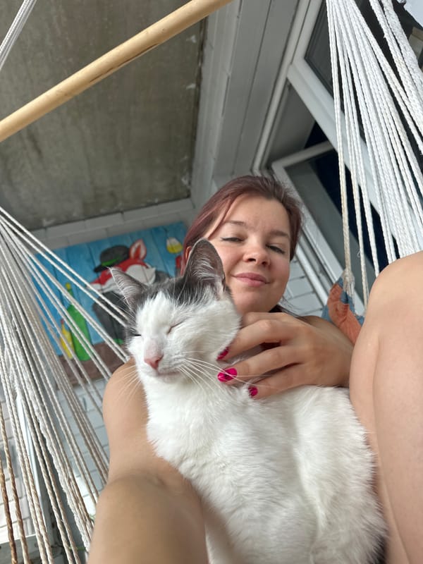 Cats and owner captured in quiet morning moments, Vladimir
