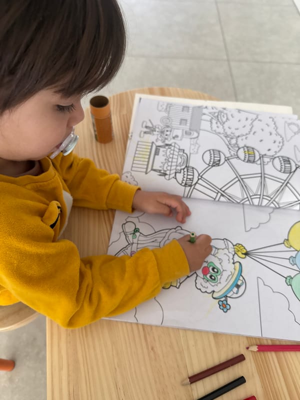 Child colors carnival-themed book in Luxembourg Saturday morning