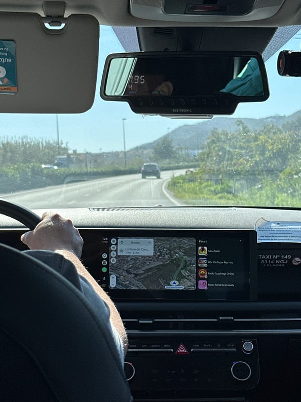 Taxi ride documented in Ibiza showing €1.95 fare, GPS navigation