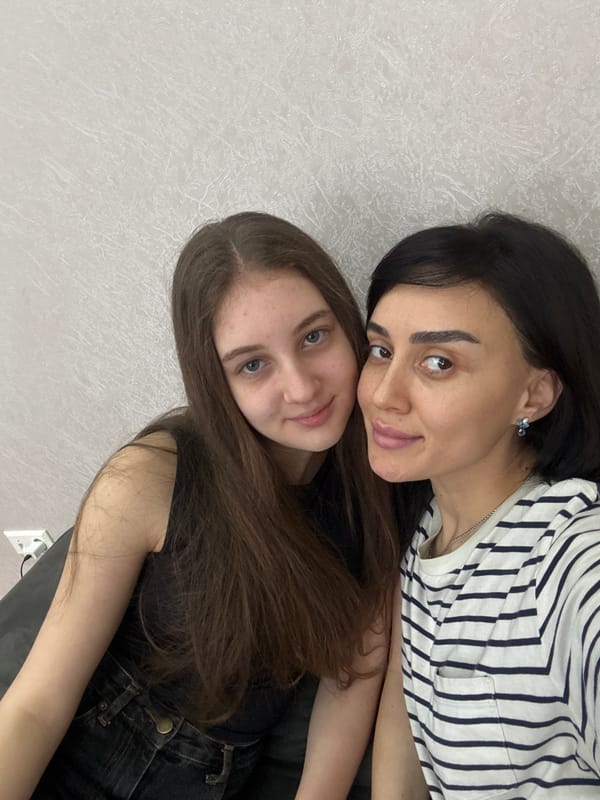 Two women share casual moments at Tbilisi residence