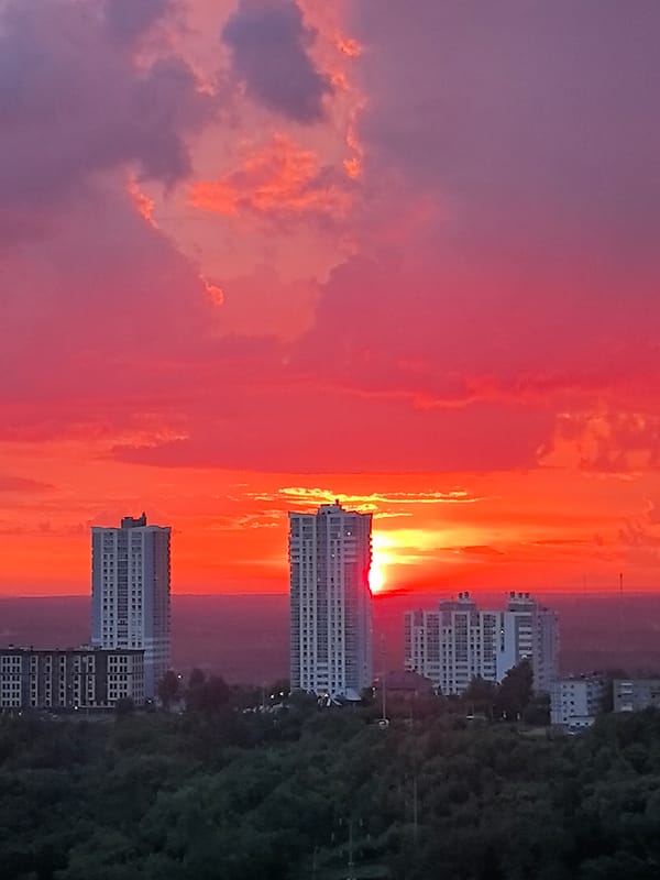 Vibrant sunset colors dramatic Perm skyline in evening light