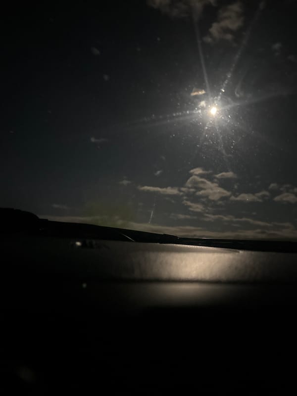 Nighttime view captured from vehicle window in Karlovo, Bulgaria