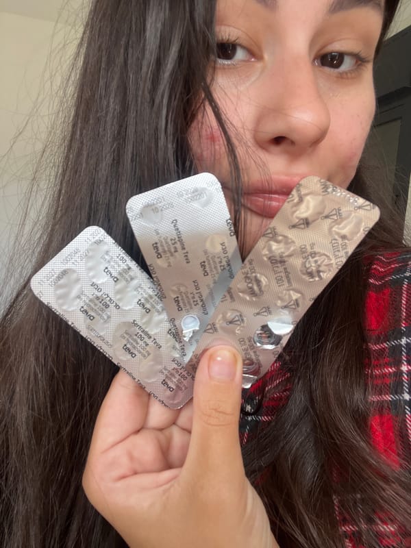 Person holds multiple medication packs in Kiryat Bialik