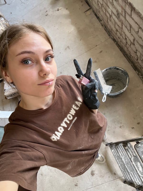 Woman renovates room in Фоки, Russia during morning hours