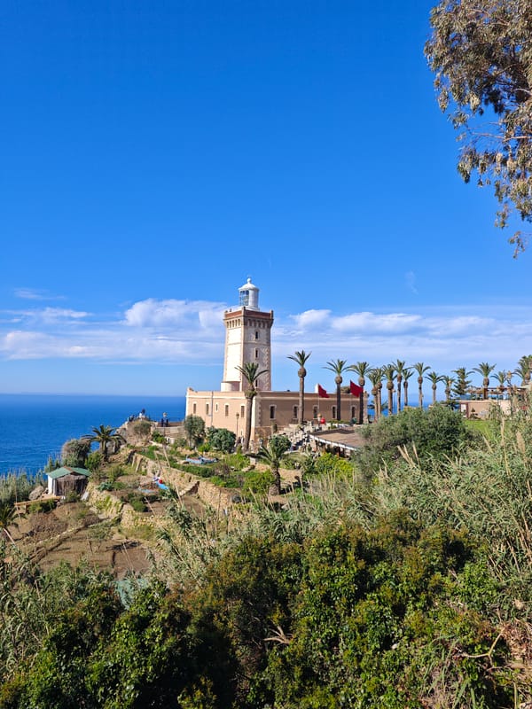 Lighthouse with Moroccan flags spotted on Tangier hilltop