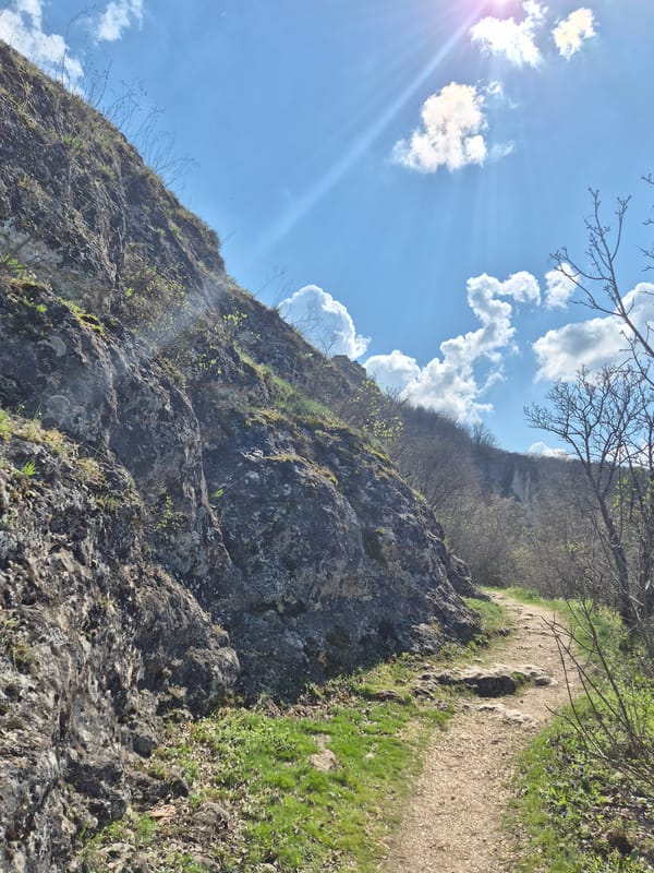 Visitors explore rocky cliffs and hiking trails in Ivanovo, Bulgaria