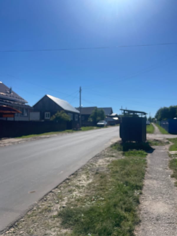 Rural Russian village street scenes documented in sunny afternoon
