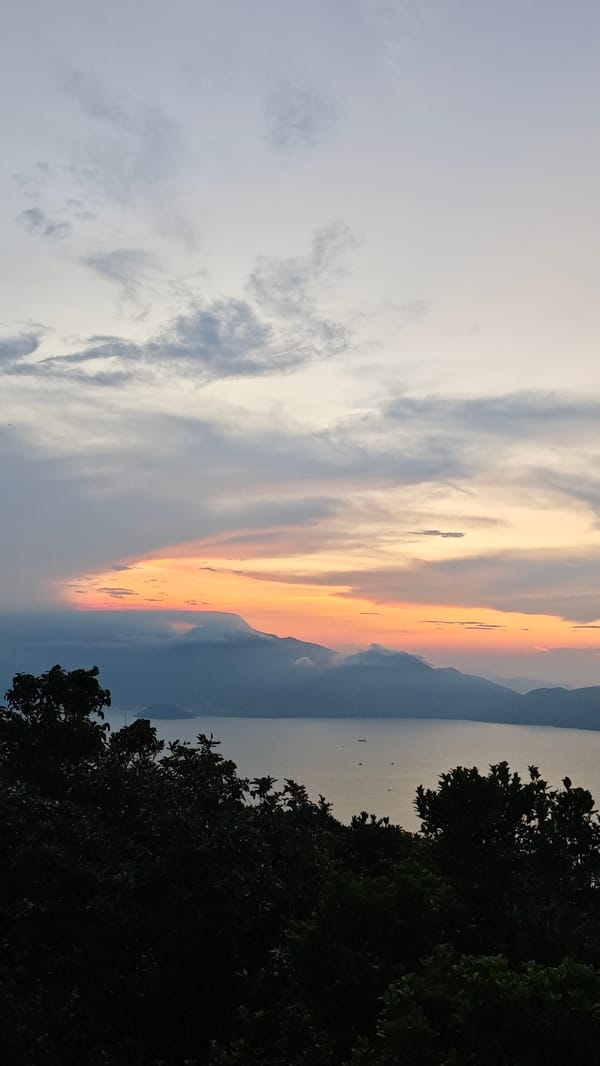 Sunrise landscape captured over water body in Đà Nẵng