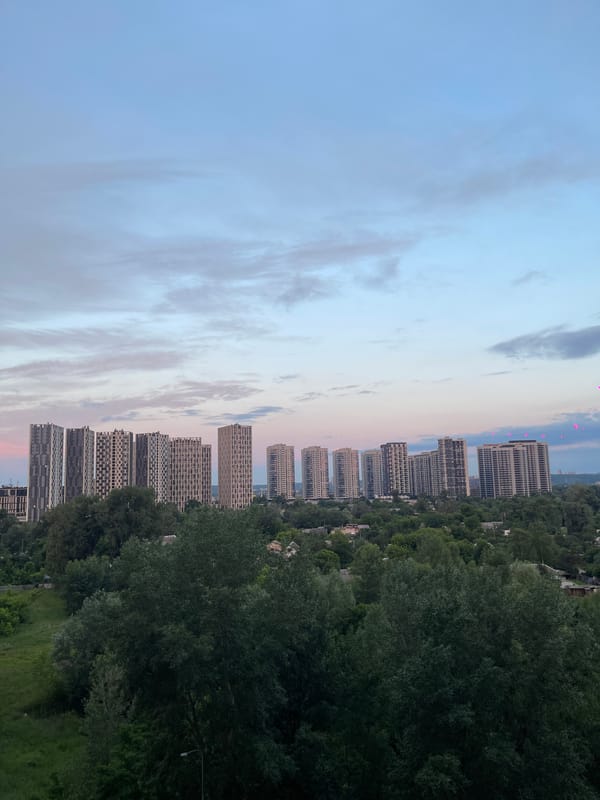 Aerial views of Kyiv construction and skyline at dusk