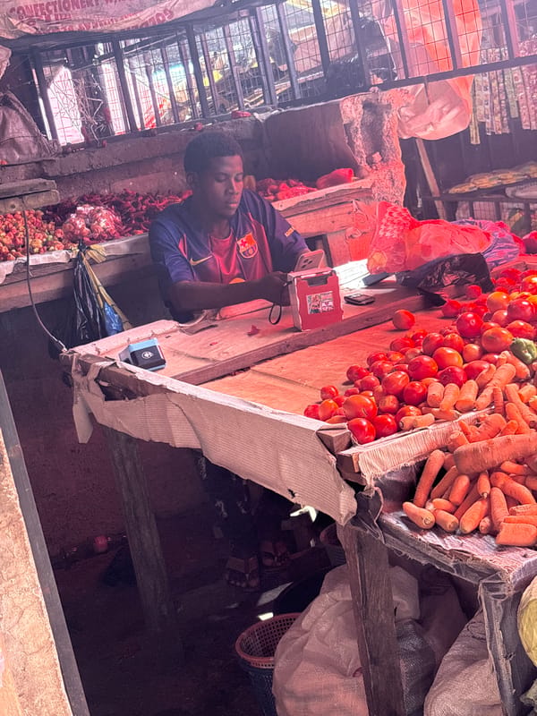 Nigerian market vendors conduct morning business in Iddo Tudunwada