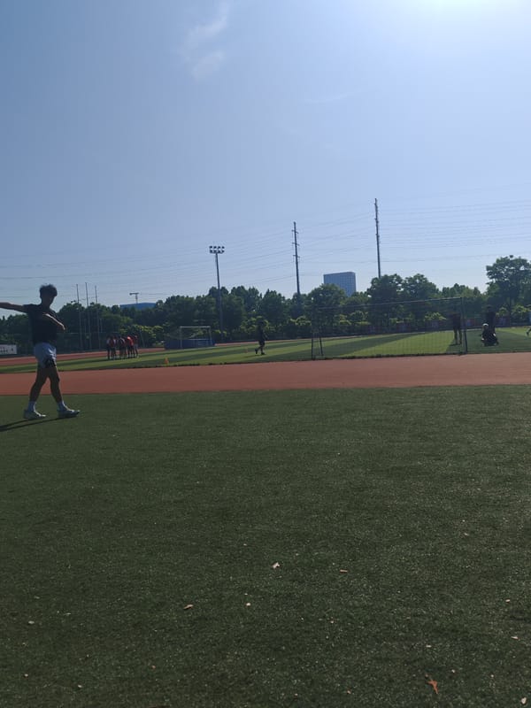 Evening activity at Jiangning District athletic field with frisbee equipment