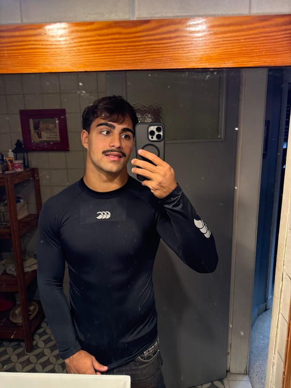 Man takes bathroom mirror selfies in Avellaneda, Argentina