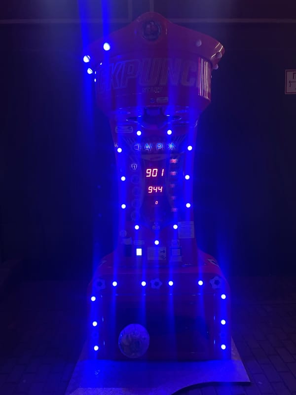 Minsk nightlife: arcade games, a casino billboard, and a neon club sign